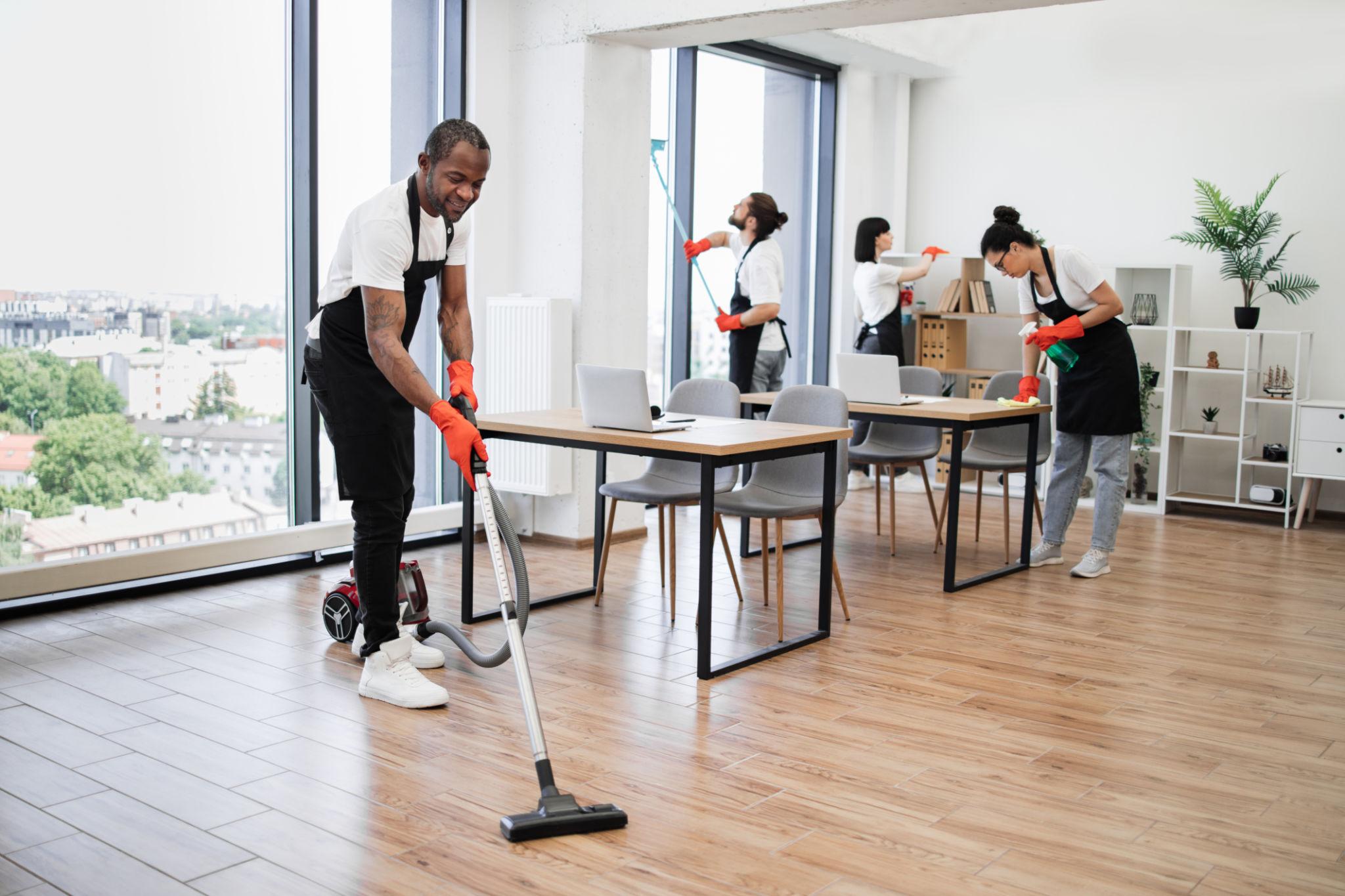 Commercial office cleaning team and equipment